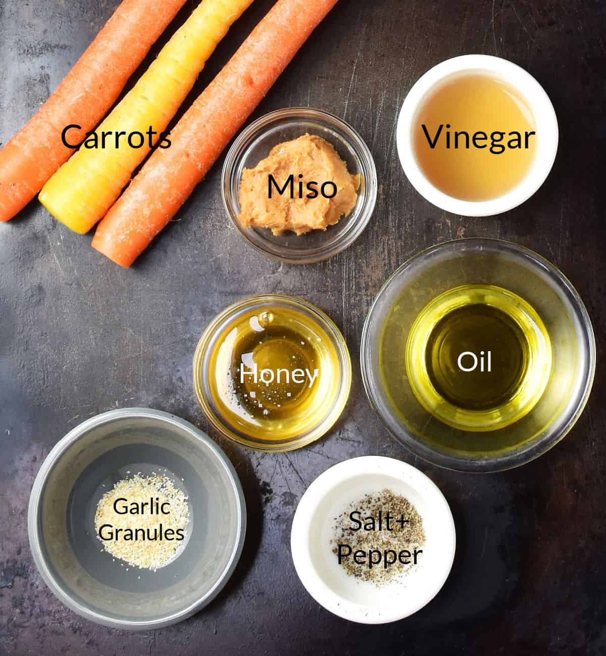 Ingredients for making miso glazed carrots in individual dishes.