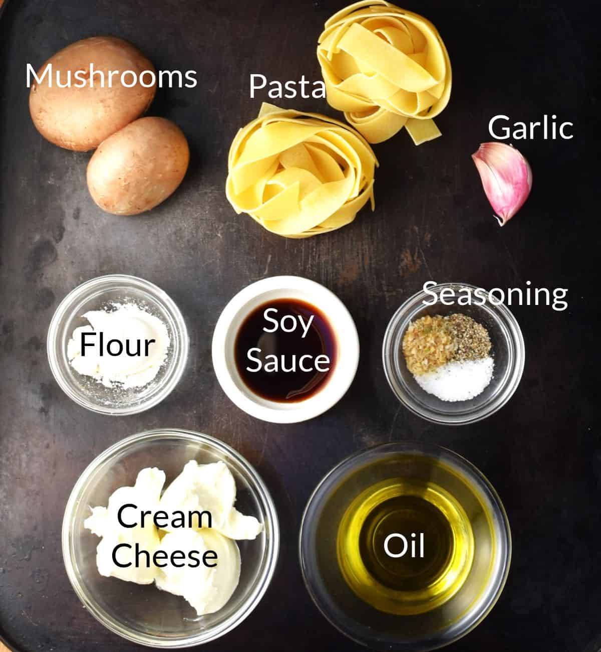 Ingredients for making mushroom pasta without cream in individual dishes.