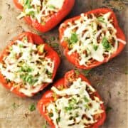 Top down view of turkey stuffed peppers on parchment.