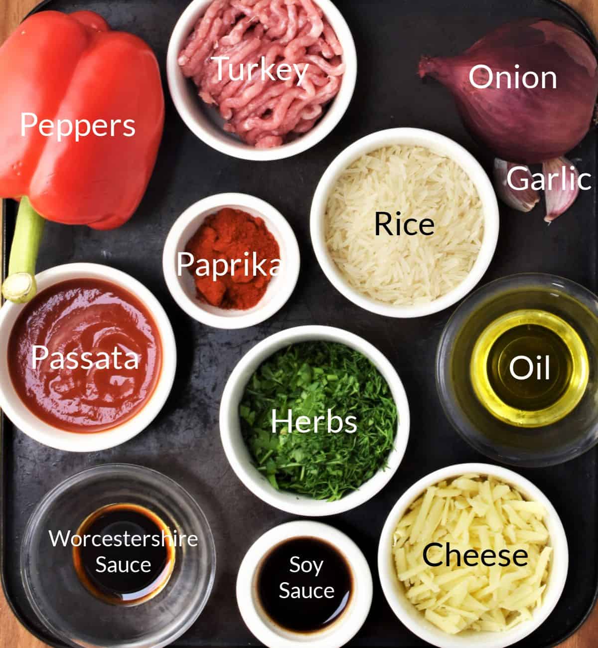 Ingredients for making turkey stuffed peppers in individual dishes.