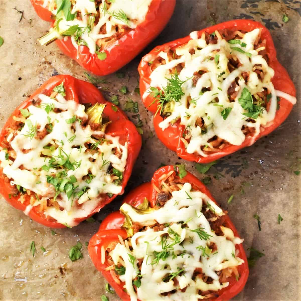 Top down view of turkey stuffed peppers on parchment.