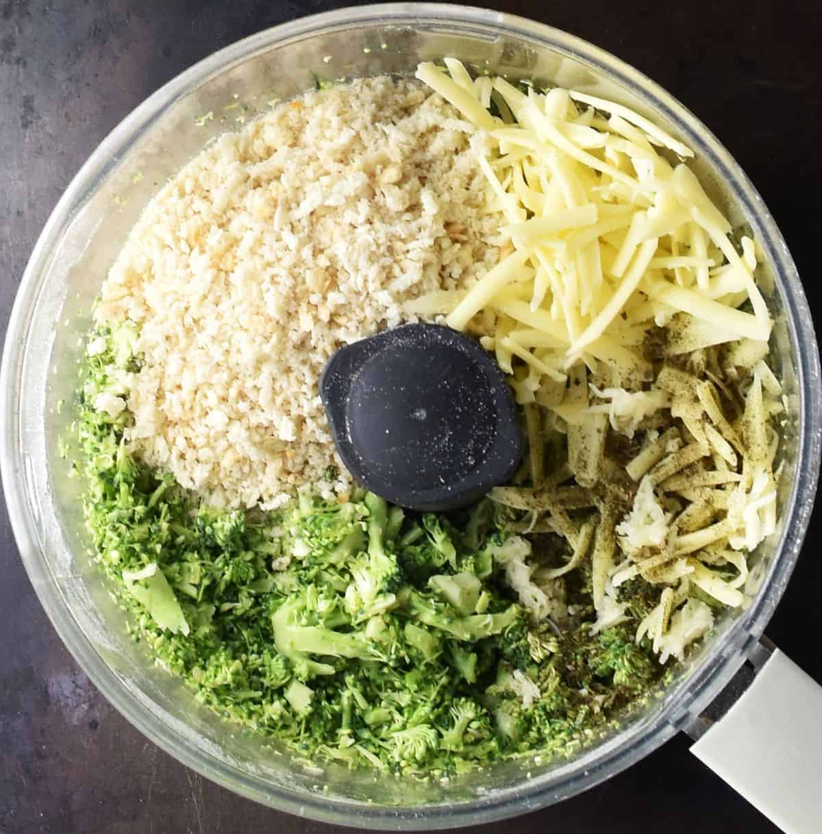 Chopped broccoli, breadcrumbs and shredded cheese in blender bowl.