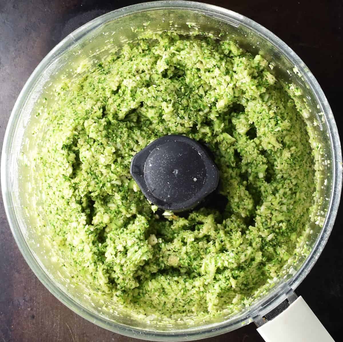 Top down view of broccoli patties batter in blender bowl.
