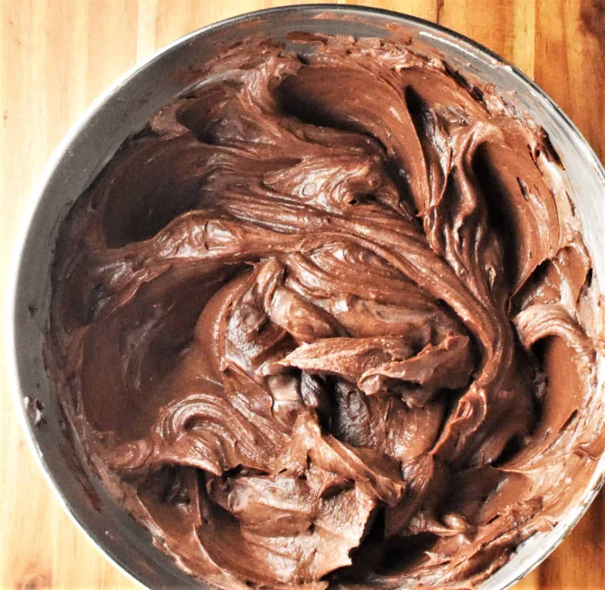 Chocolate cheesecake filling mixture in bowl.
