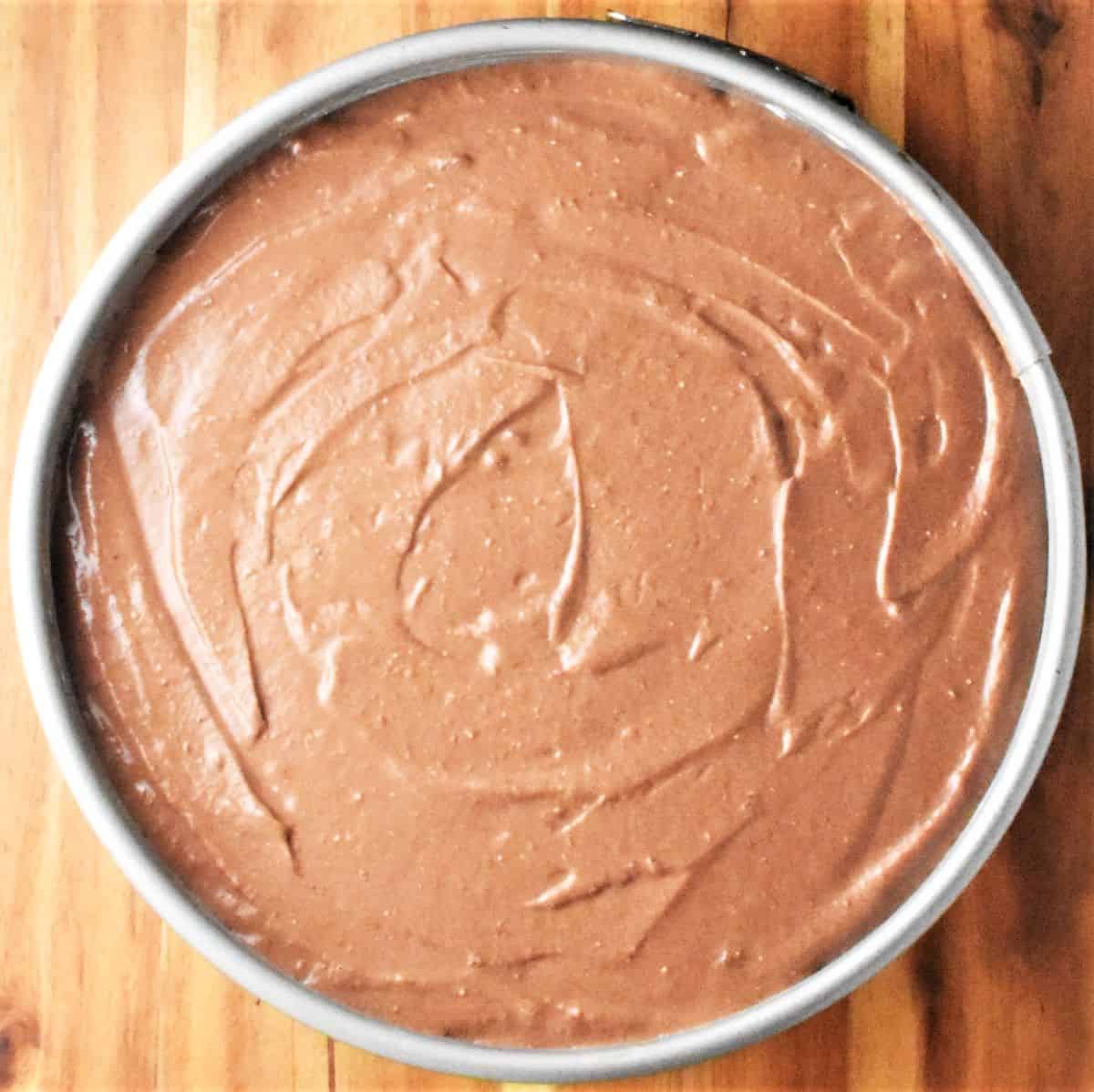 Chocolate cheesecake in round pan.