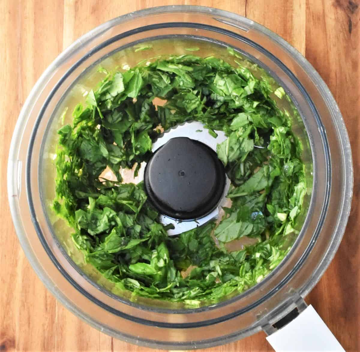 Basil leaves in food processor.