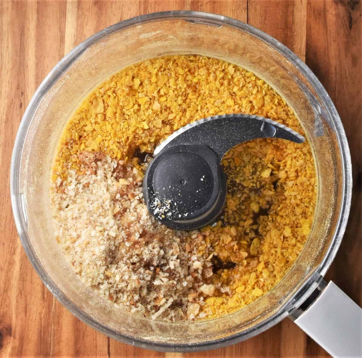 Cornflake crumbs and breadcrumbs in food processor.