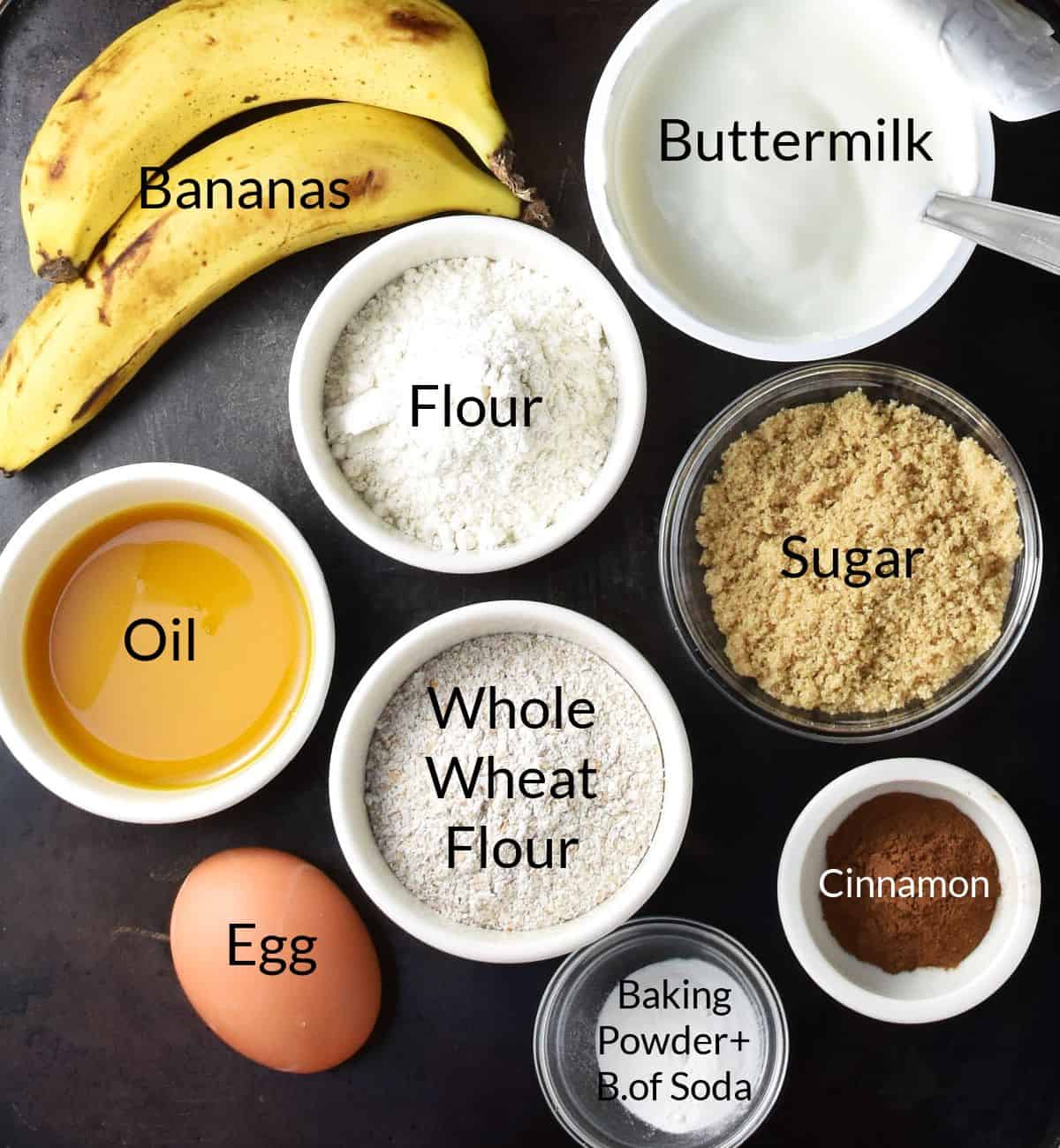 Top down view of ingredients for making banana and buttermilk muffins in individual dishes.