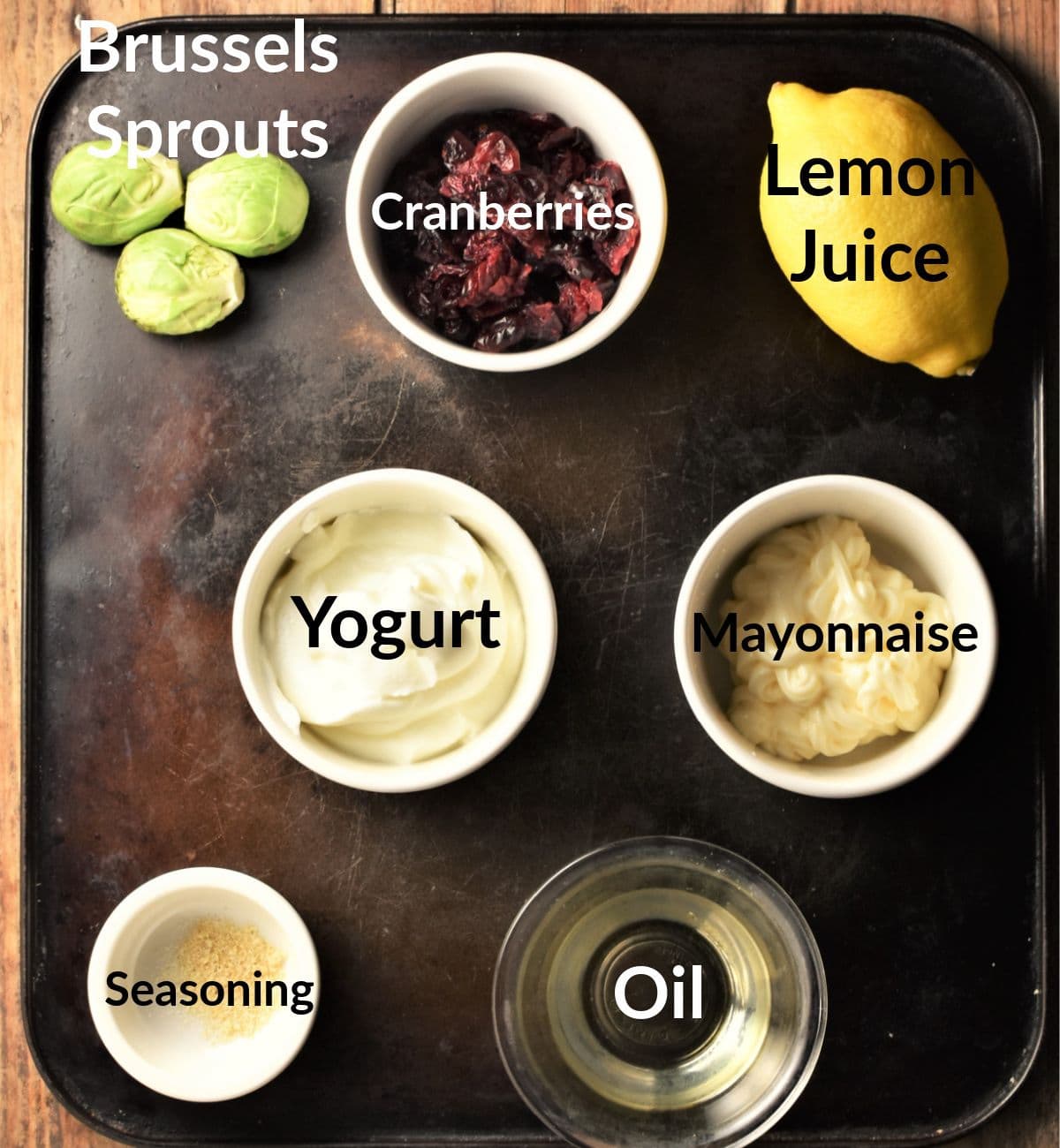 Ingredients for brussel sprout slaw in individual dishes.