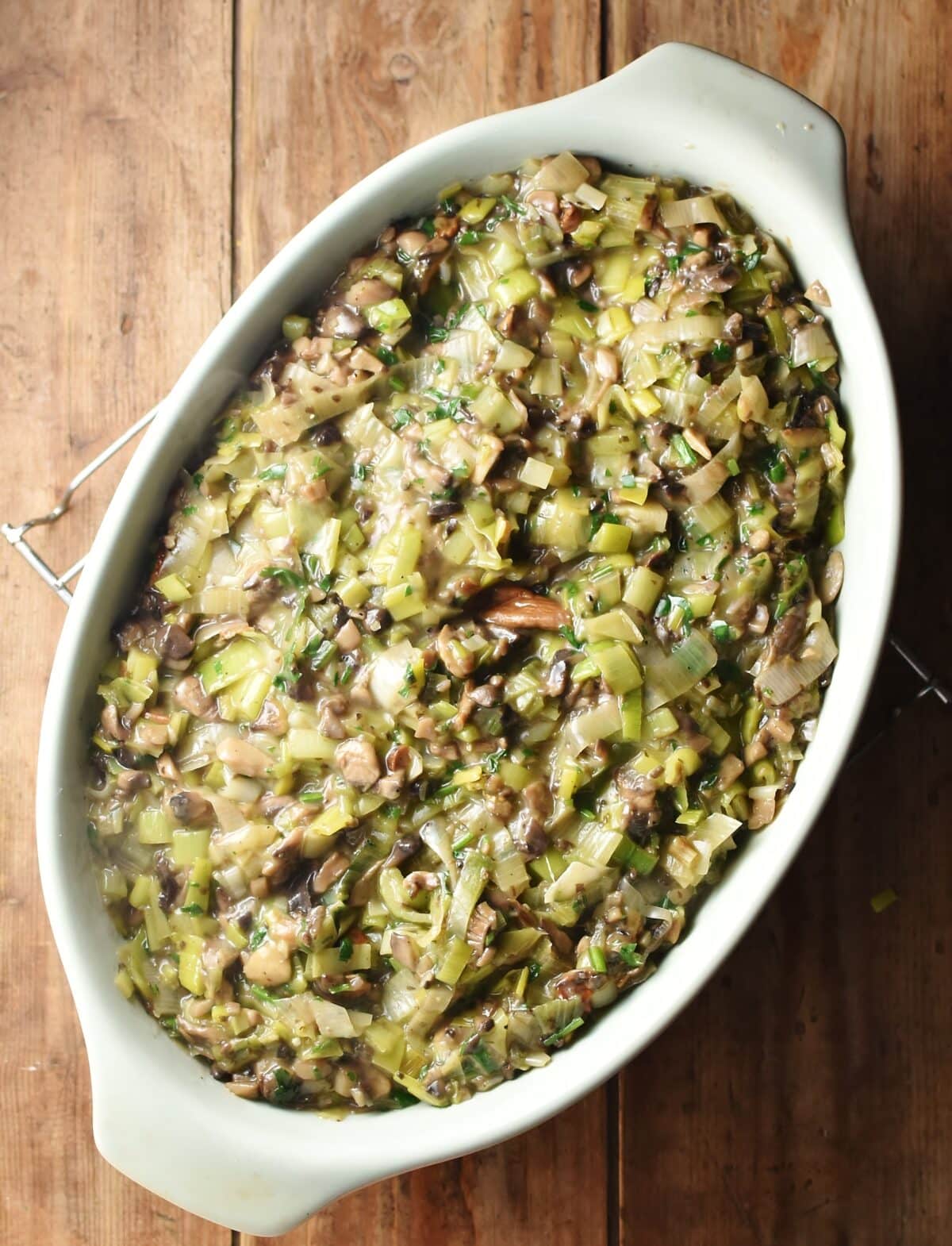 Creamy mushroom and leek mixture in oval casserole dish.