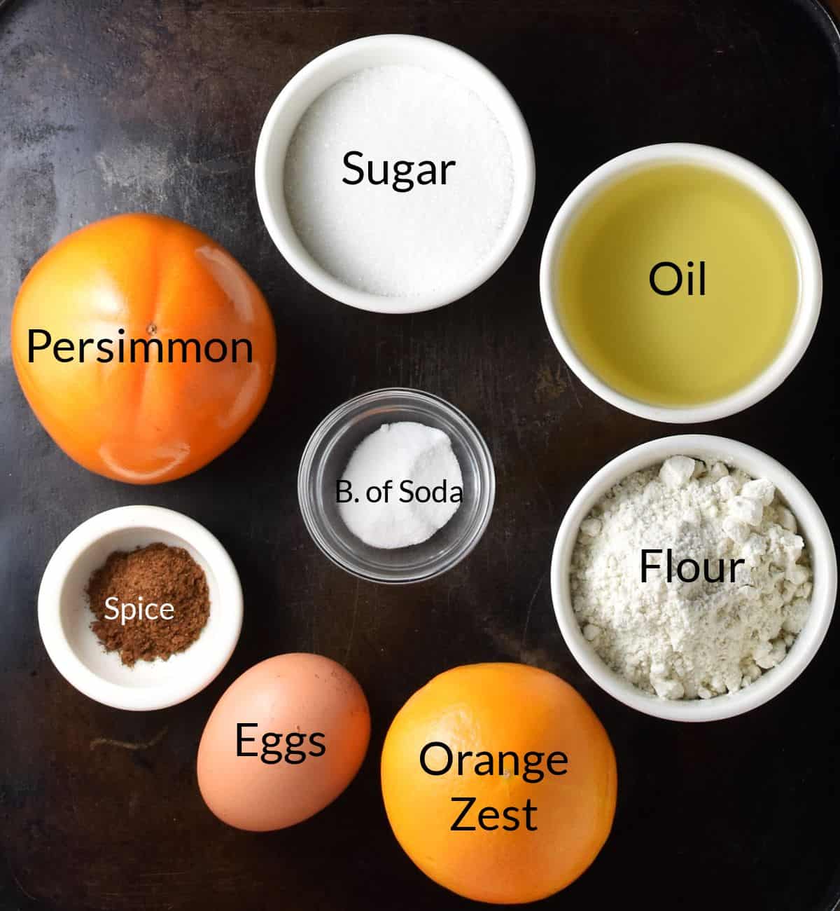 Ingredients for making persimmon bread in individual dishes.