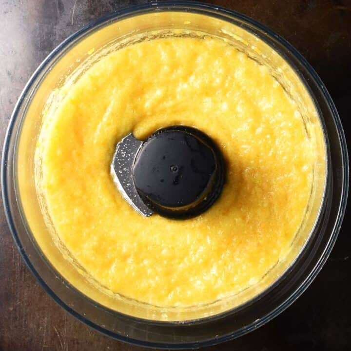 Persimmon puree in food processor bowl.