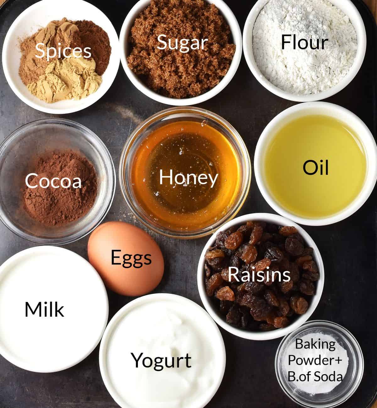 Top down view of gingerbread muffin ingredients in individual dishes.