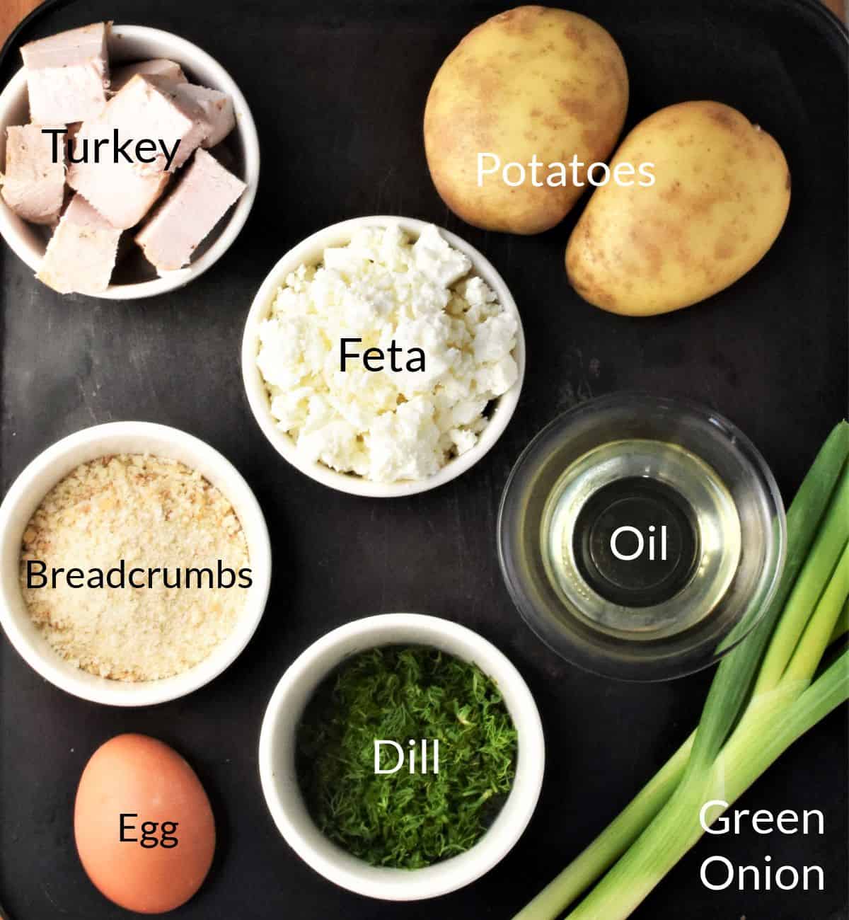 Ingredients for making turkey potato cakes in individual dishes.
