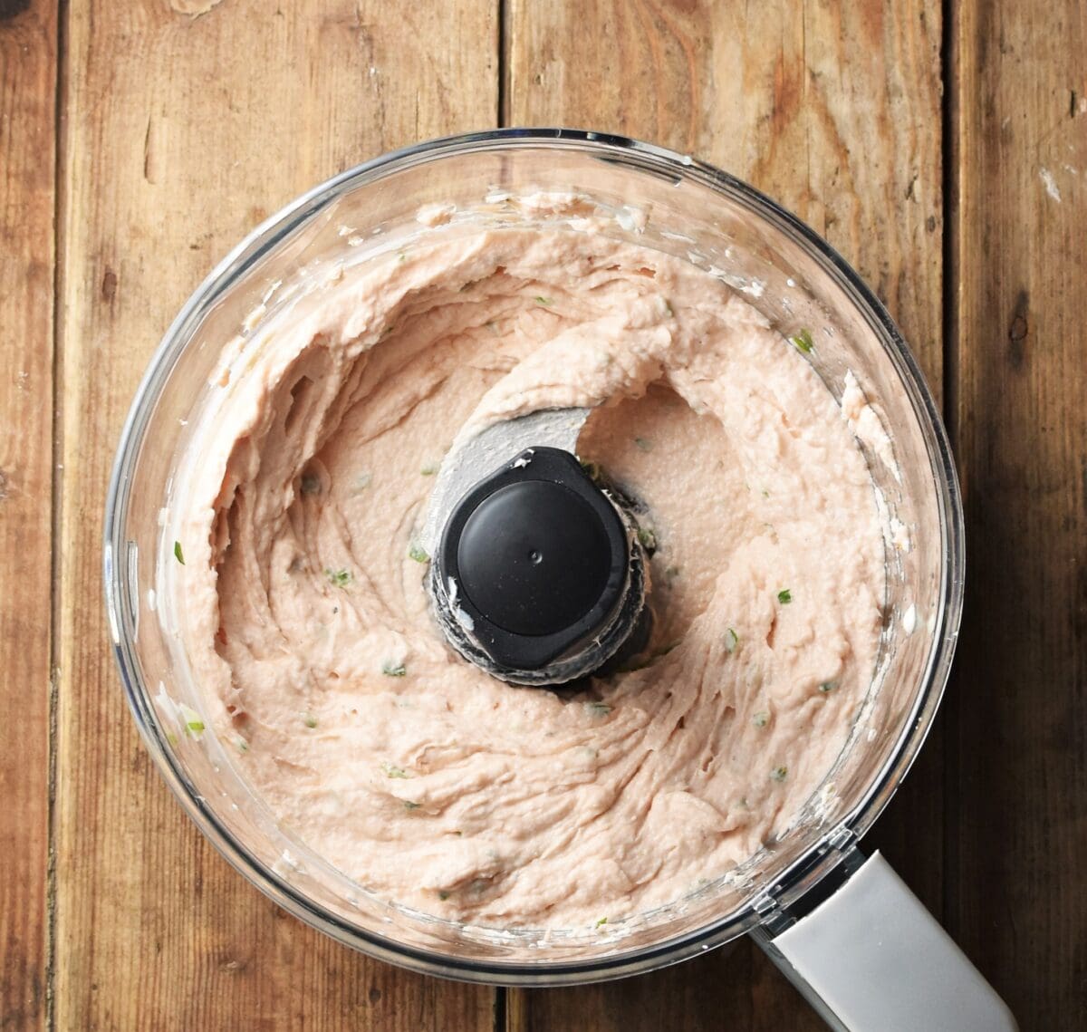 Creamy salmon spread mixture in blender.