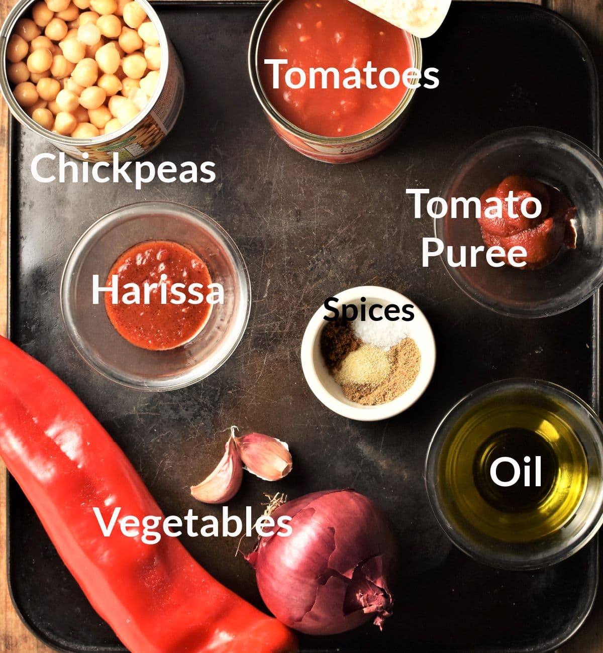 Ingredients for making vegan chickpea stew in individual dishes.