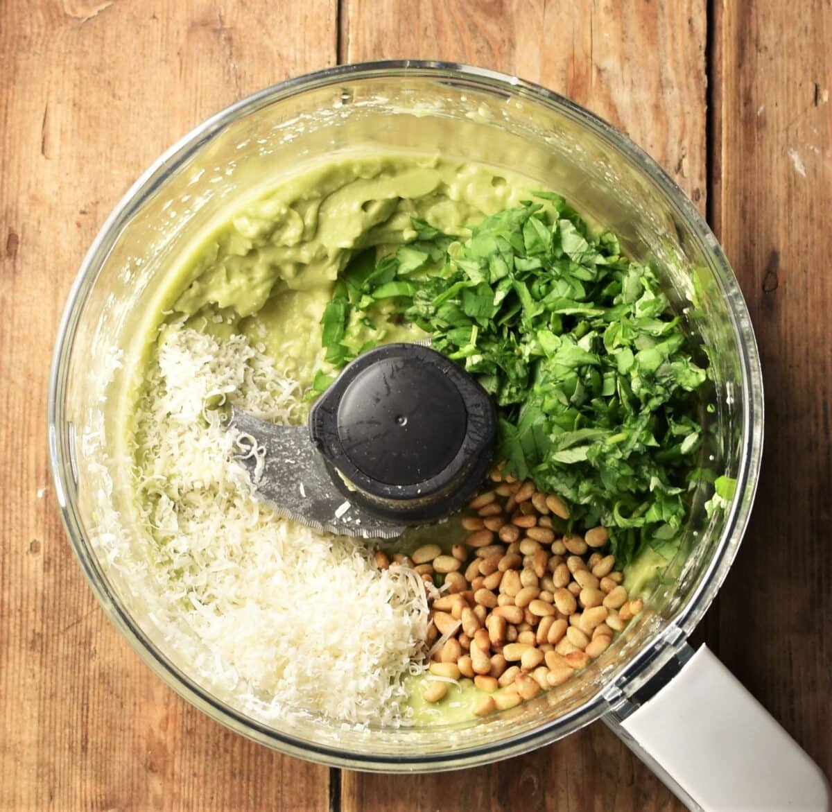 Avocado pesto ingredients in blender.