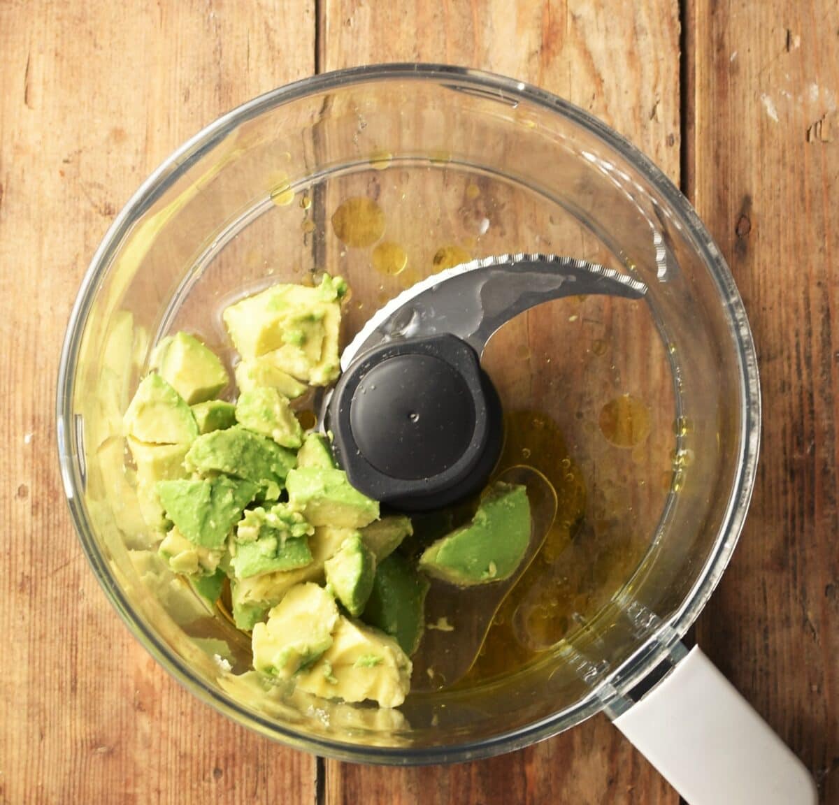 Avocado flesh and water in blender.