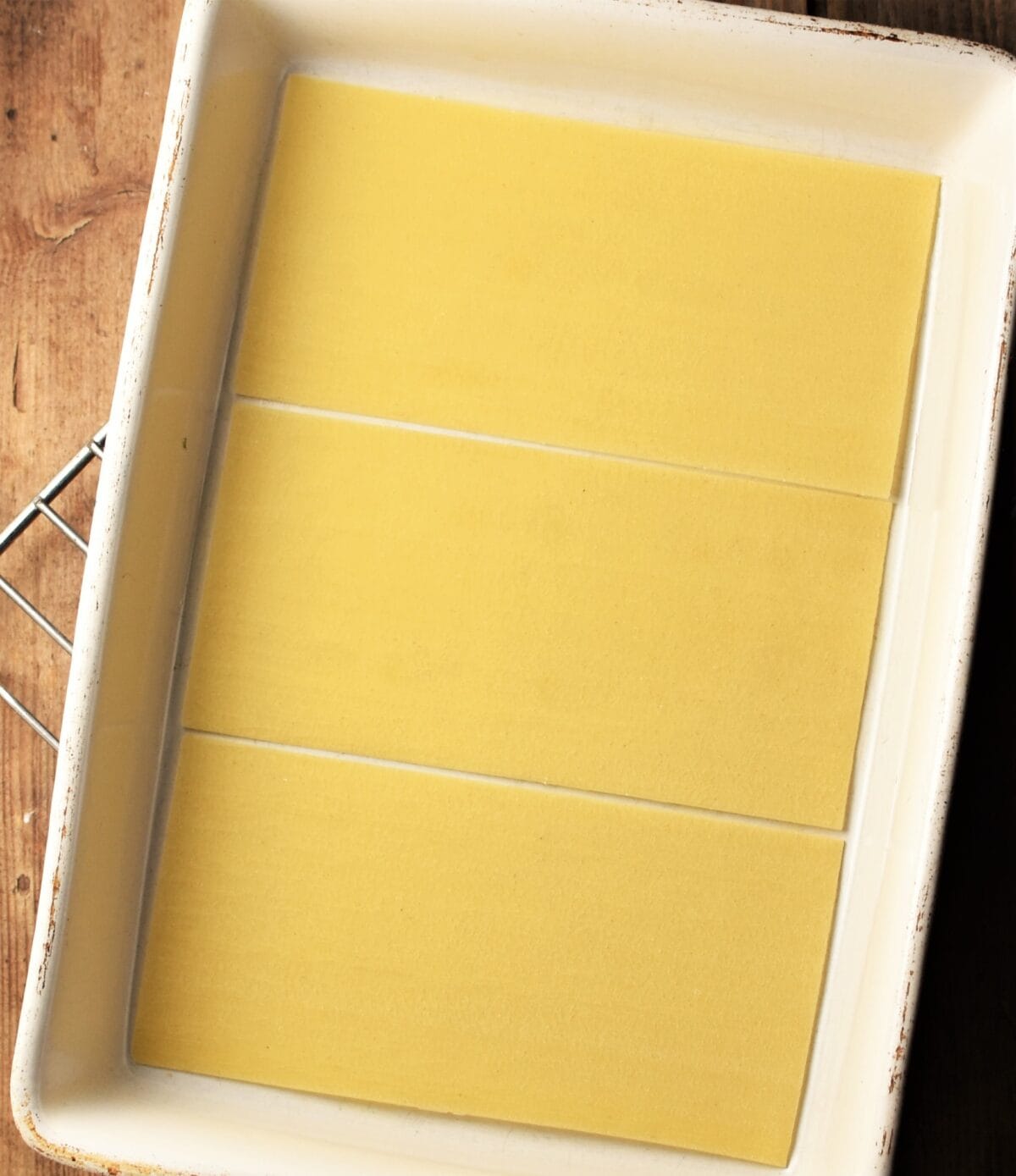 Top down view of lasagna sheets inside dish.