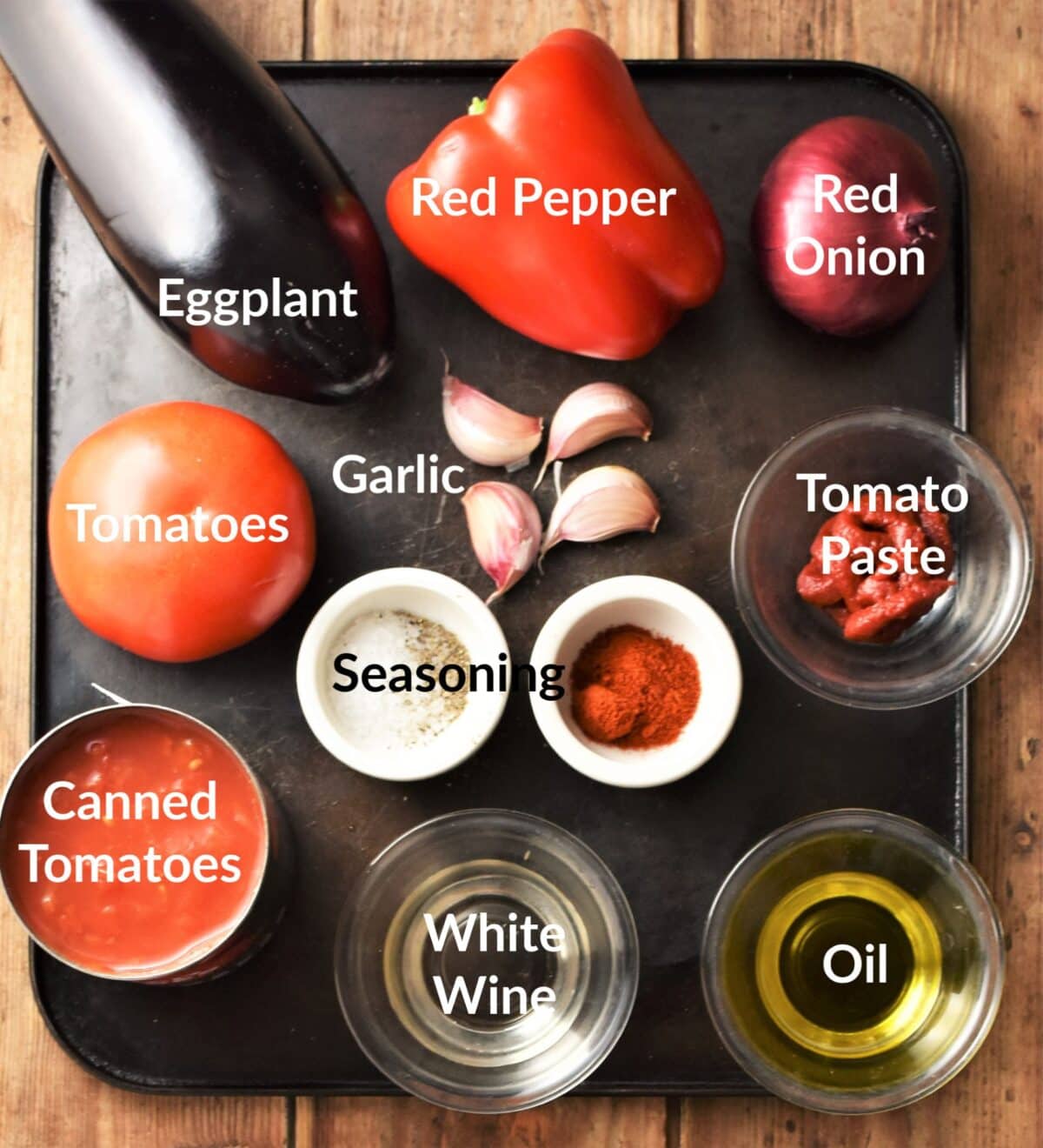 Eggplant tomato sauce ingredients in individual dishes.
