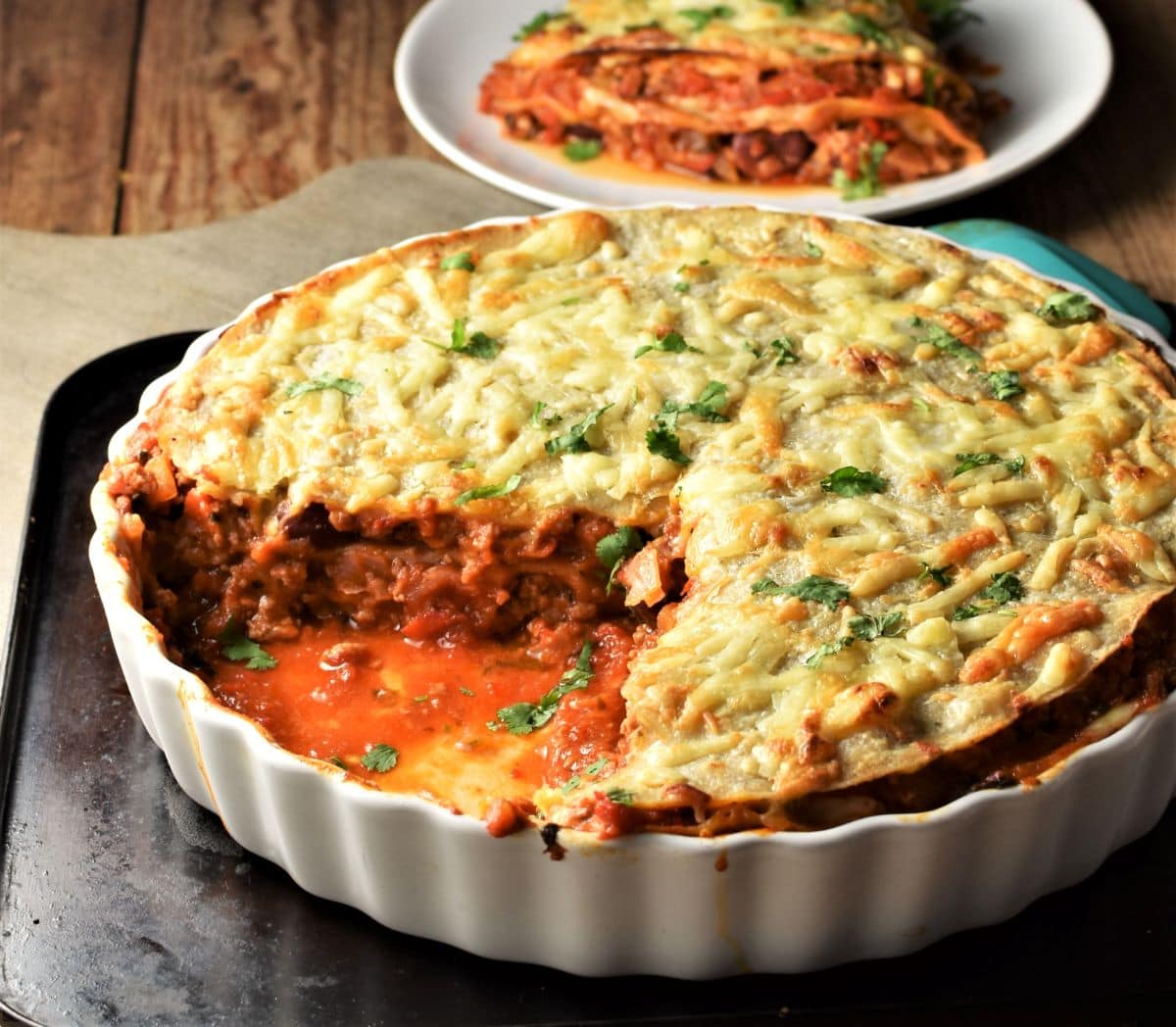 Side view of cut tortilla bake in pie dish.