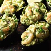 Close-up view of shrimp stuffed avocado halves.