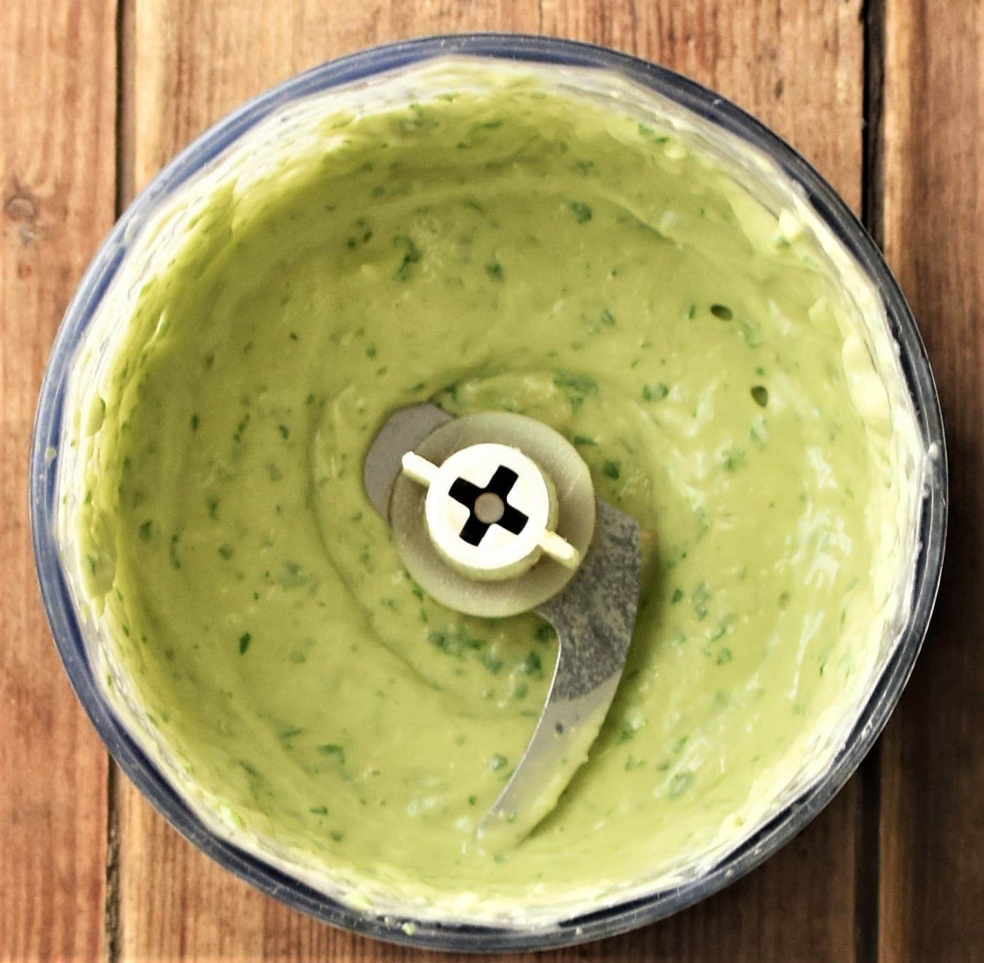 Creamy avocado sauce in blender.