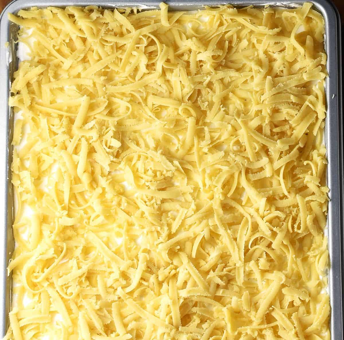 Shredded plesniak crumb topping in pan.