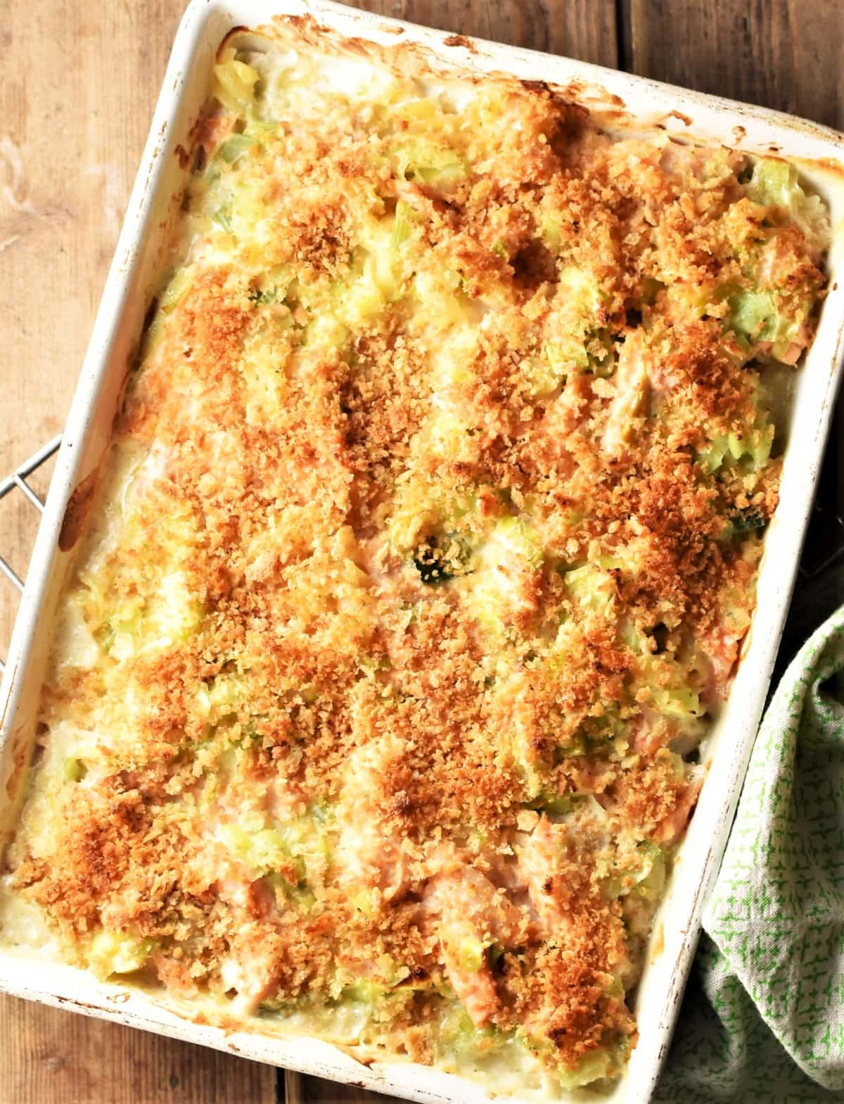 Top down view of salmon leek pasta bake with crispy topping.