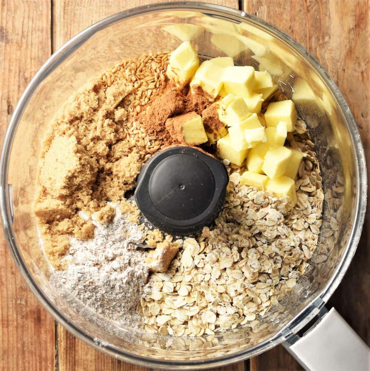 Crumble topping ingredients in food processor bowl.