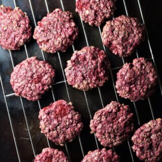 Raspberry cookies on top of rack.