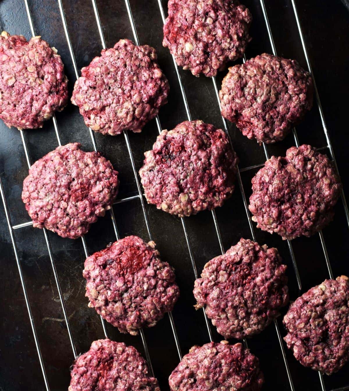 Raspberry cookies on top of rack.