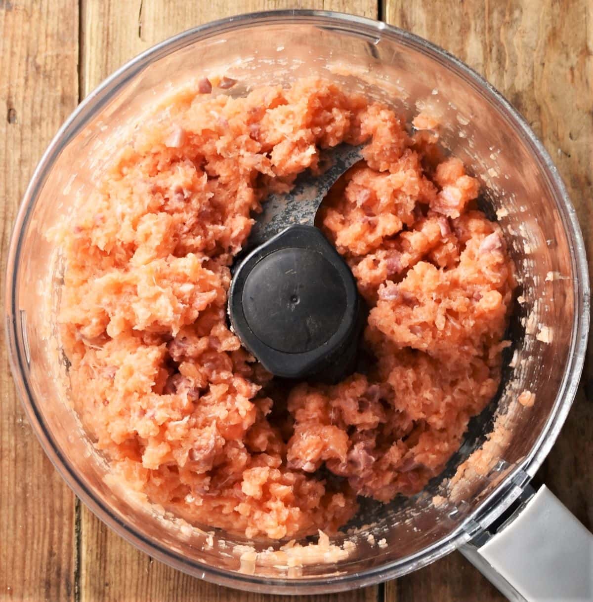 Salmon mixture in food processor bowl.