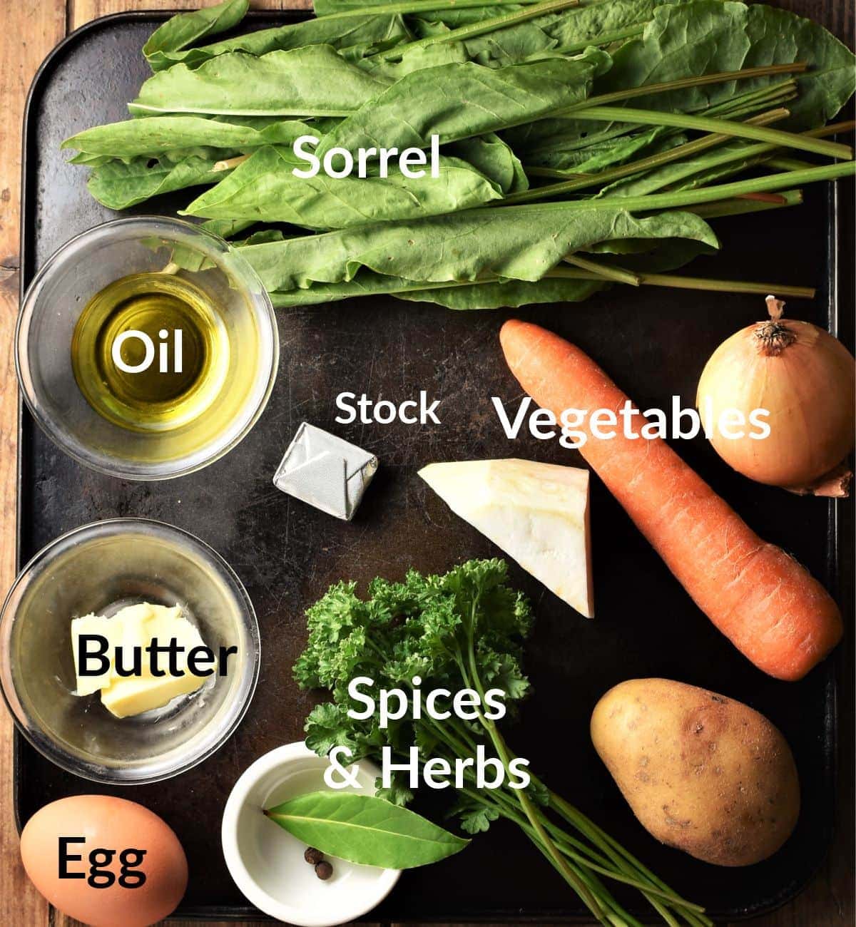 Polish sorrel soup ingredients in individual dishes.