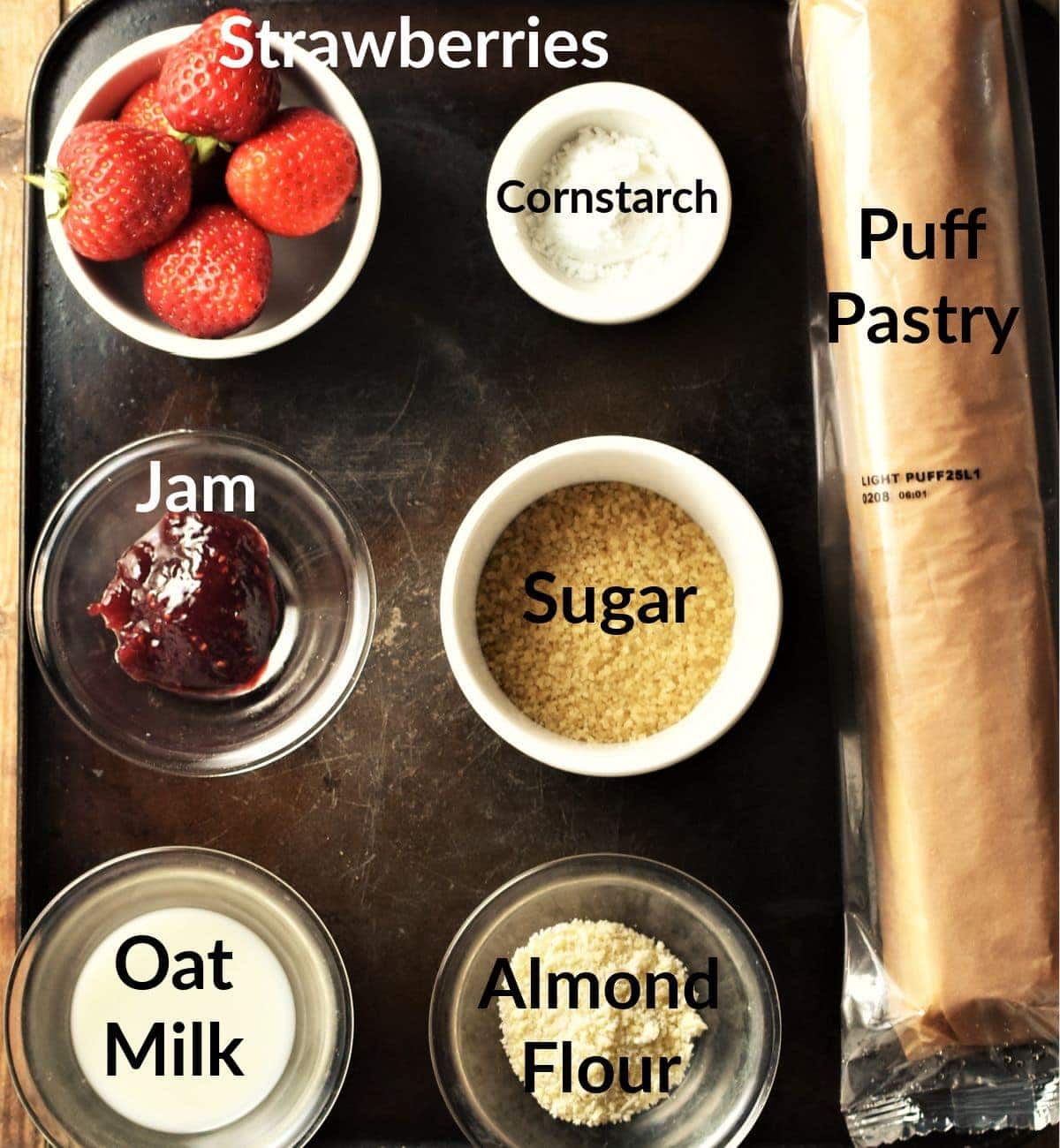 Vegan strawberry turnovers ingredients in individual dishes.