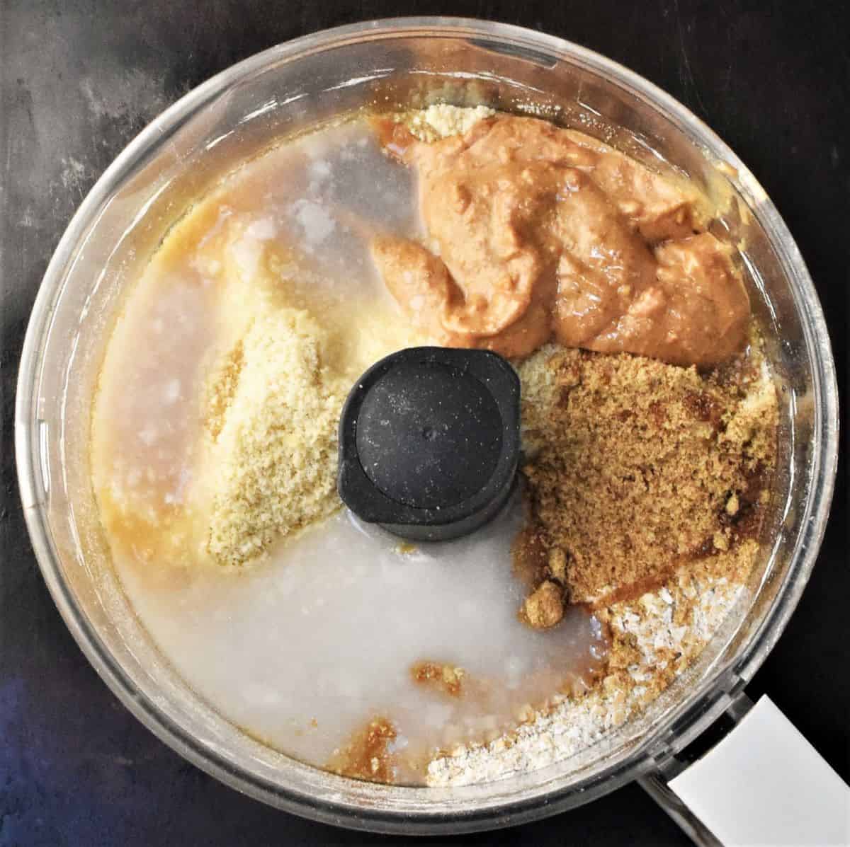 Ingredients for oat bars mixture in food processor.