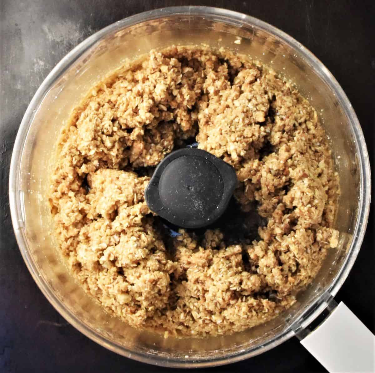 Crumbly oat mixture for oatmeal blueberry bars base in food processor.