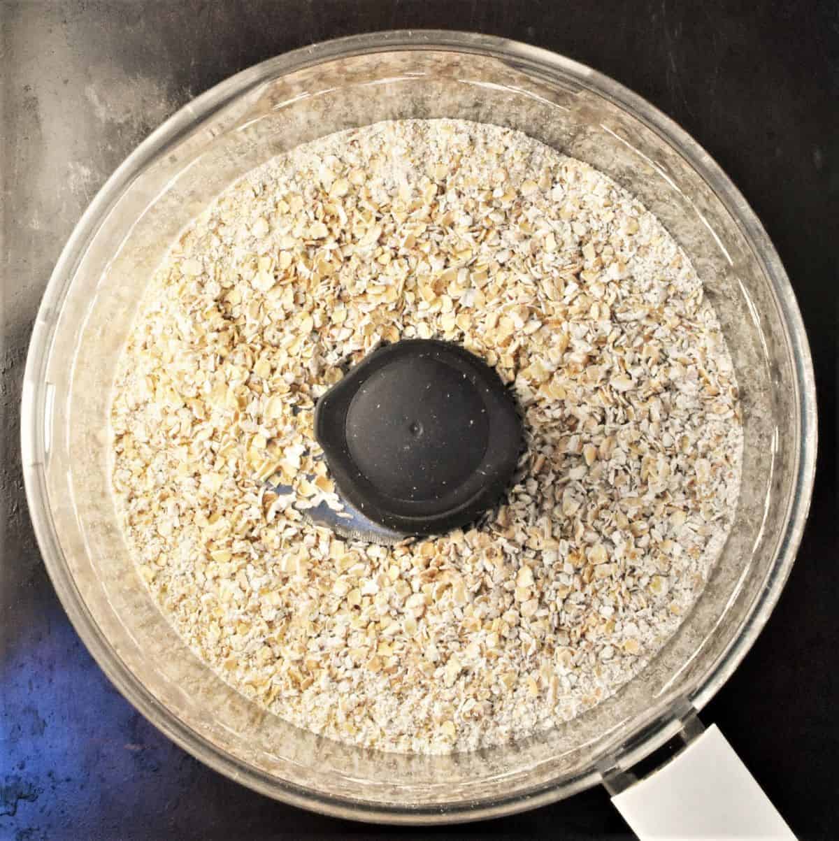Top down view of oats in food processor.