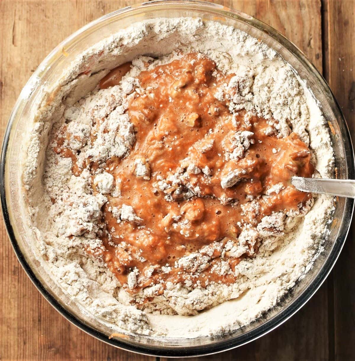 Flour and carrot mixture in bowl.