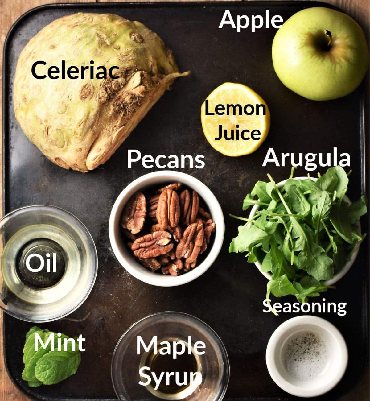 Celeriac salad ingredients in individual dishes.