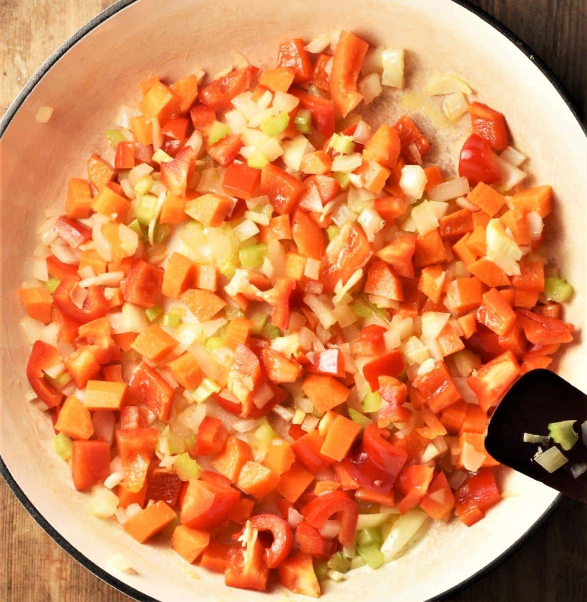 Chopped vegetables in white shallow pan.