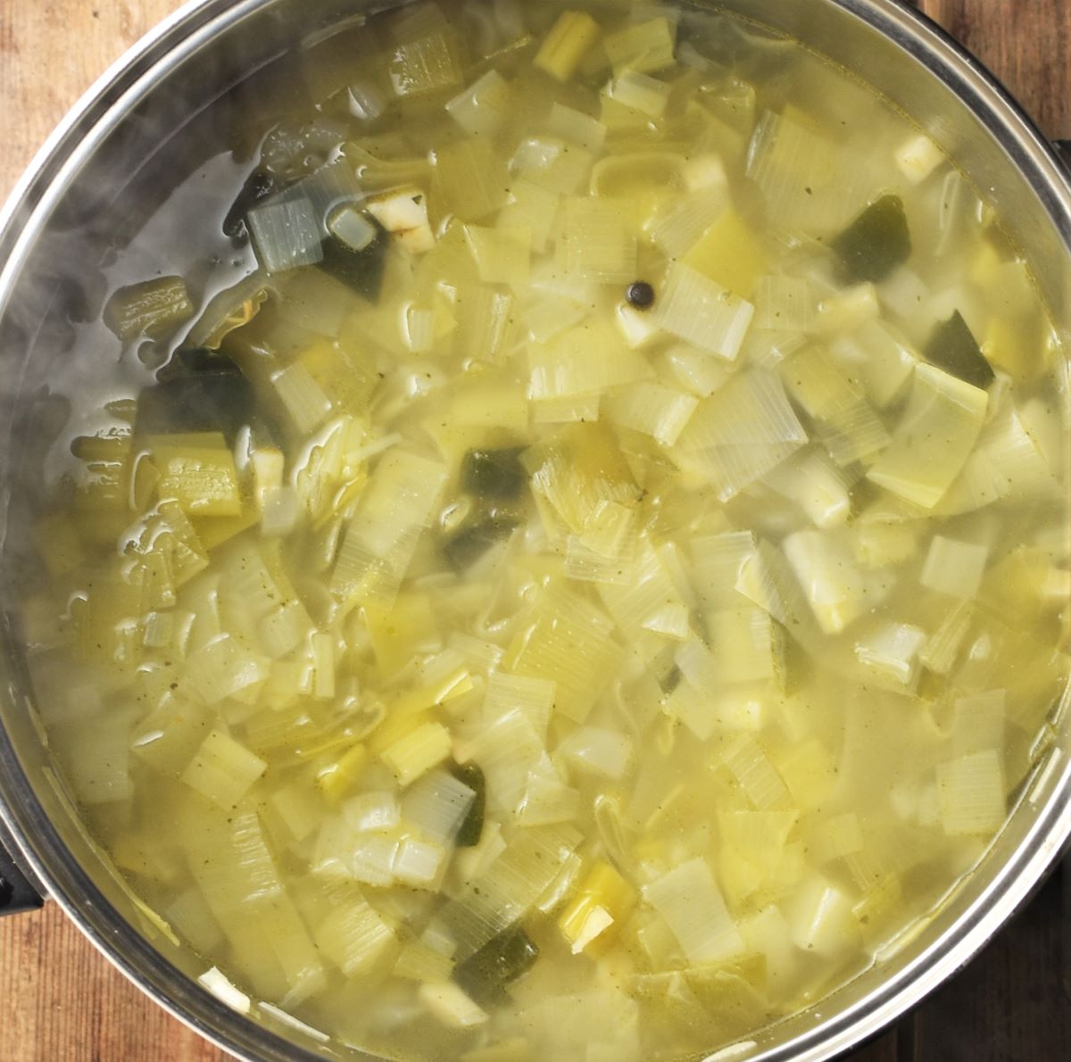 Chunky potato leek soup in pot.