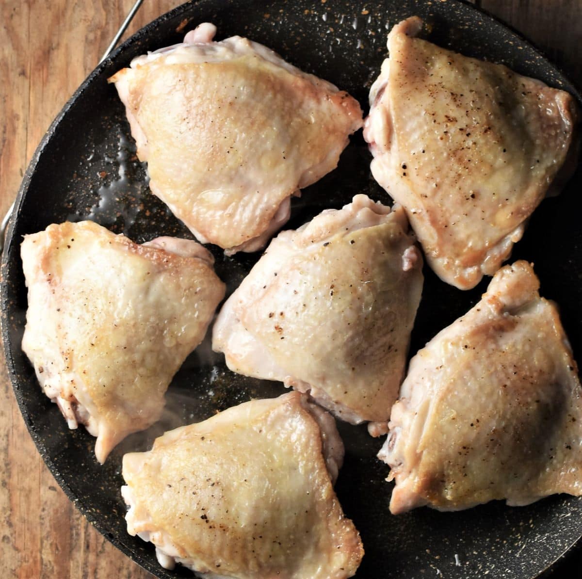 6 chicken thighs in large frying pan.