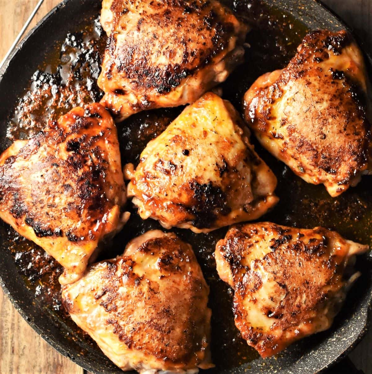 6 browned chicken thighs in large pan.