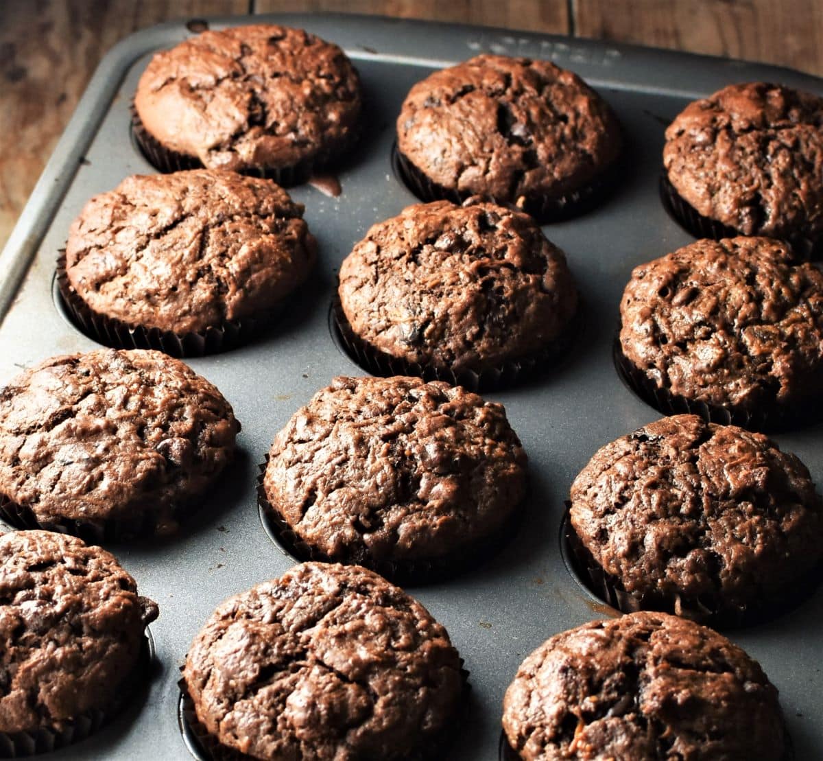 Side view of 12 muffins in pan.