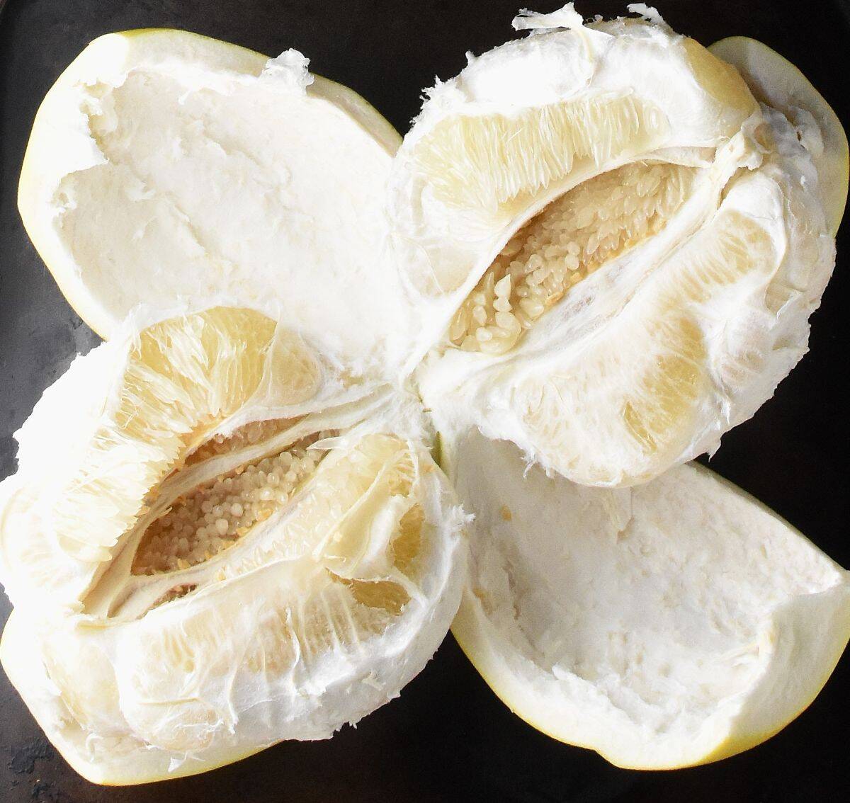 Top down view of peeled pomelo fruit.