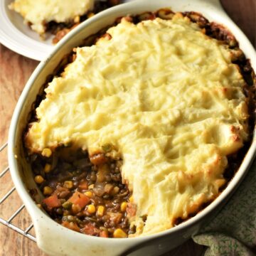 Lentil and vegetable shepherd's pie in oval dish.