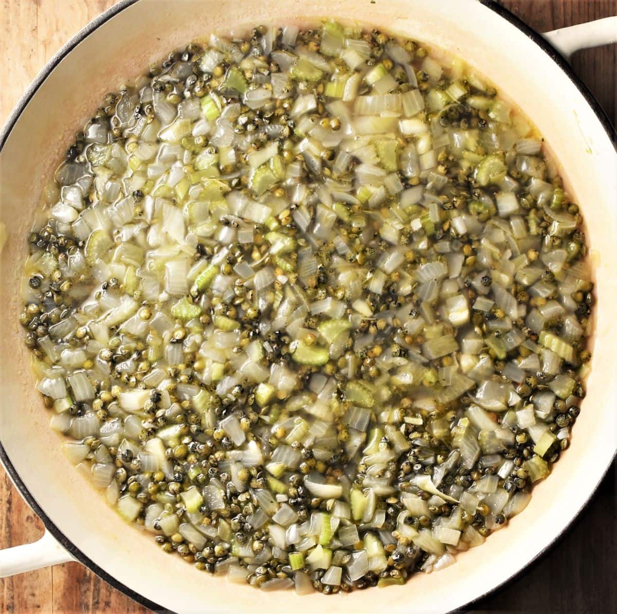 Cooking lentils and onion in large shallow pan.