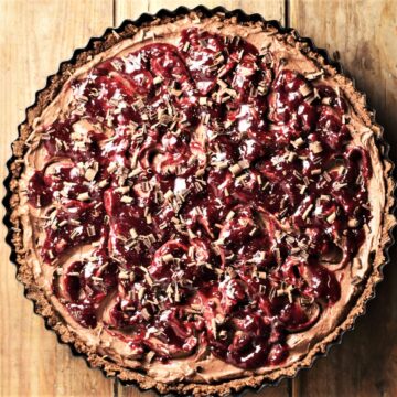 Black forest cheesecake tart in round tin.
