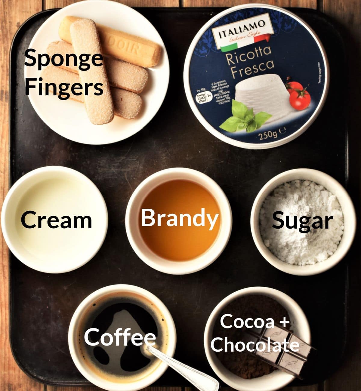 Ingredients for making tiramisu cups in individual dishes.